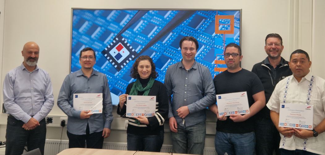 People proudly showing certificates